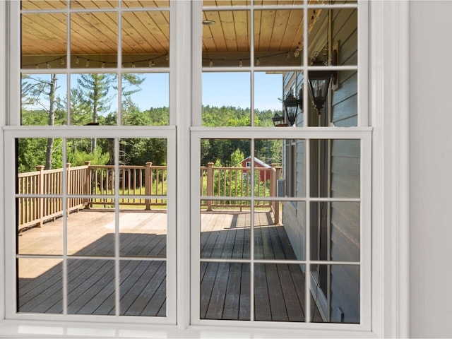 doorway to outside featuring wood ceiling