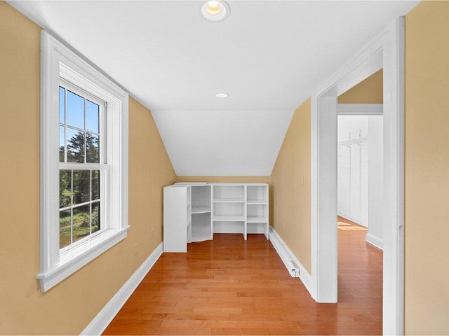 bonus room featuring vaulted ceiling, recessed lighting, light wood-style flooring, and baseboards