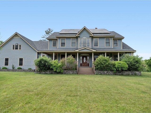 colonial-style house with covered porch, a front lawn, and solar panels