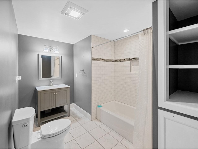 full bathroom featuring baseboards, visible vents, toilet, tile patterned floors, and vanity