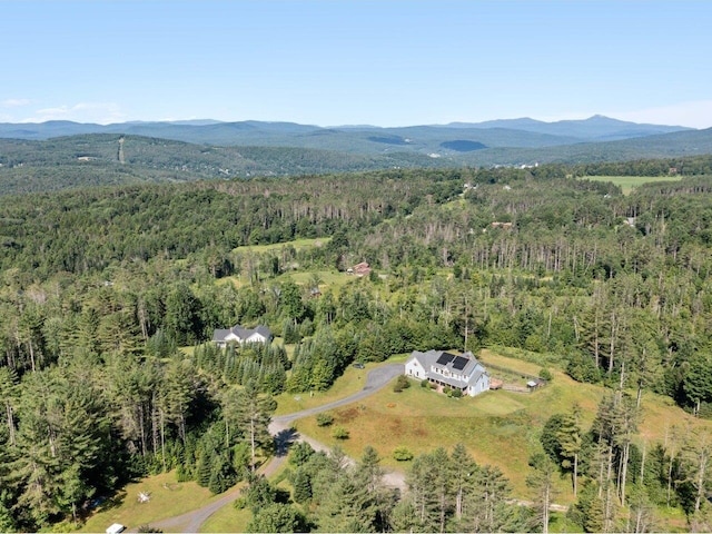 bird's eye view featuring a wooded view and a mountain view