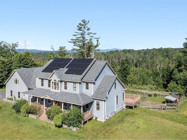 aerial view featuring a wooded view