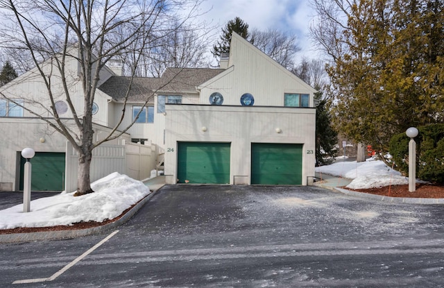 exterior space featuring driveway and stucco siding