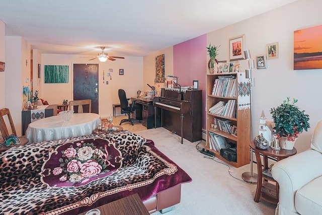 living room with ceiling fan and carpet