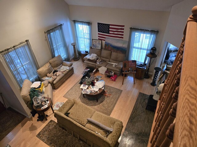 96 Mason Dr, Milan, NH 03588 - living area with a high ceiling and wood finished floors