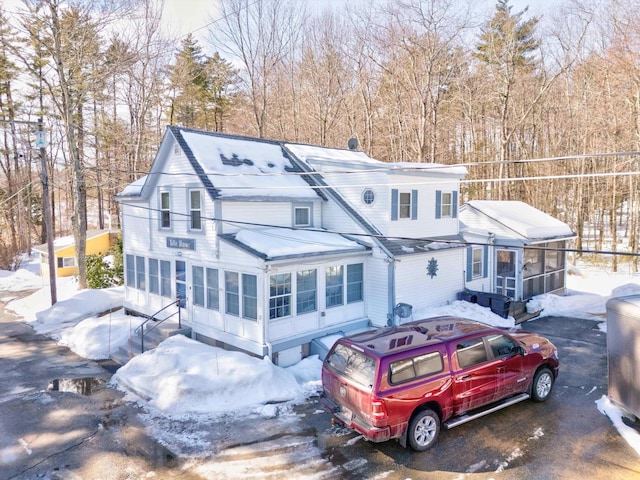 view of front of property featuring a sunroom