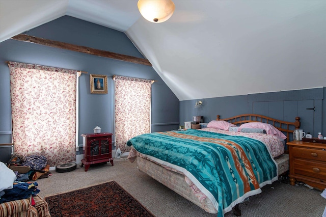 bedroom with vaulted ceiling and carpet floors