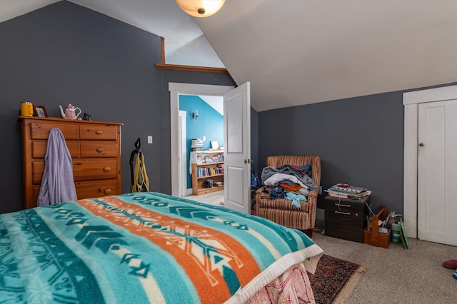 carpeted bedroom featuring lofted ceiling