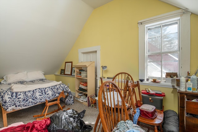 carpeted bedroom featuring lofted ceiling