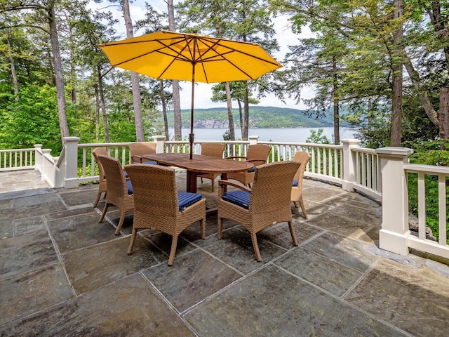 view of patio / terrace with a water view and outdoor dining area