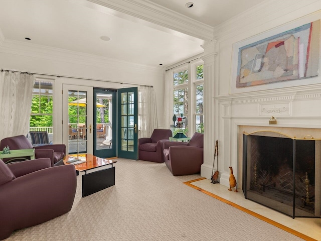 living area with carpet flooring, a wealth of natural light, and crown molding