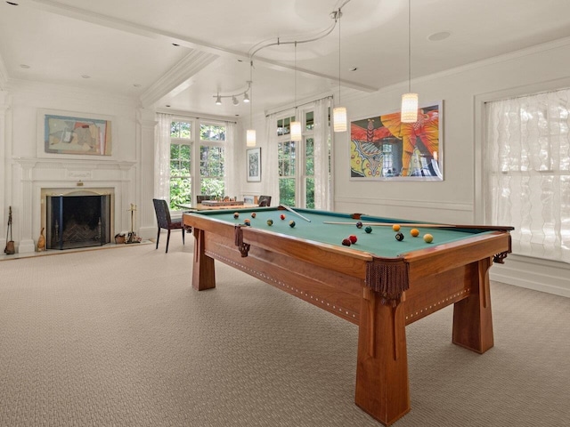 rec room featuring ornamental molding, pool table, and a fireplace with raised hearth