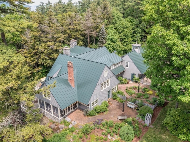 bird's eye view with a wooded view