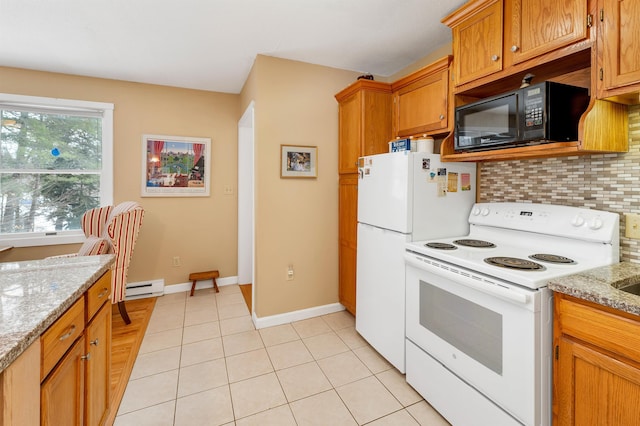 kitchen featuring light tile patterned floors, decorative backsplash, a baseboard heating unit, white appliances, and baseboards