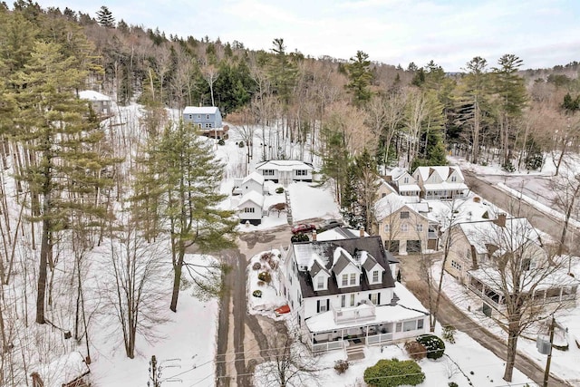 birds eye view of property with a wooded view and a residential view