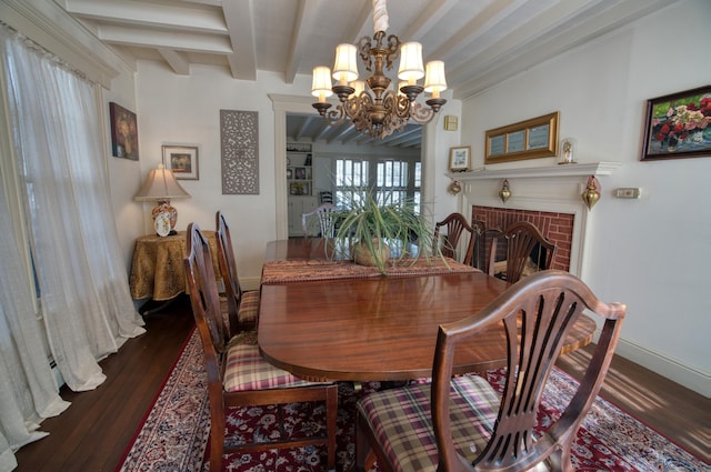 dining space with an inviting chandelier, baseboards, beamed ceiling, and wood finished floors