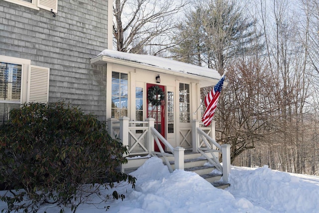 view of snow covered property entrance