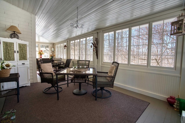 sunroom with wood ceiling and vaulted ceiling