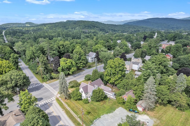 drone / aerial view featuring a mountain view and a forest view