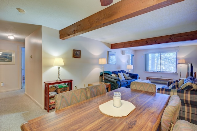 dining space with baseboards, a textured ceiling, carpet flooring, an AC wall unit, and beam ceiling