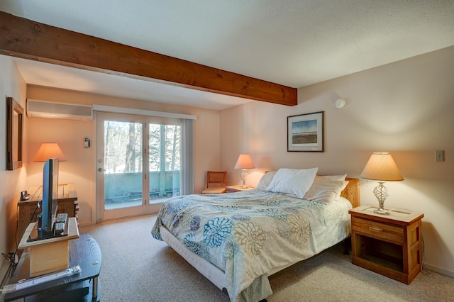 carpeted bedroom with baseboards, an AC wall unit, beamed ceiling, and access to exterior