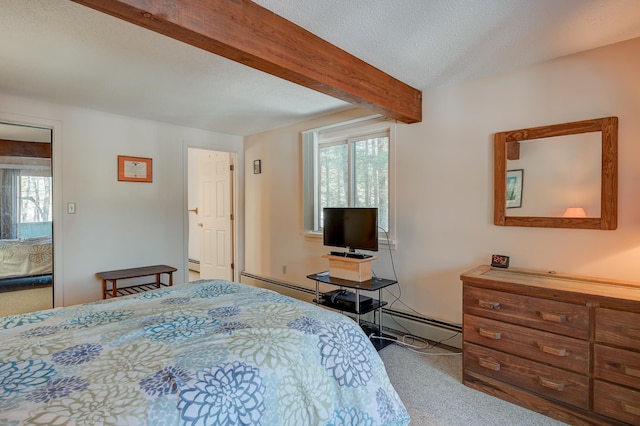 bedroom featuring a baseboard heating unit, carpet floors, a textured ceiling, and beam ceiling