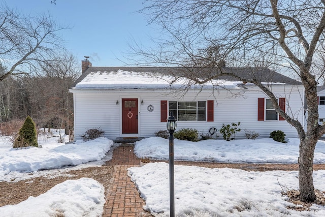 view of front of home featuring a chimney