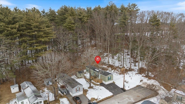 snowy aerial view featuring a residential view