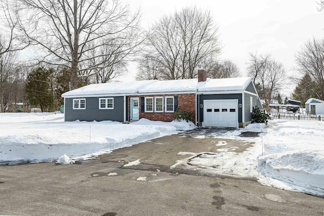 ranch-style home featuring a chimney, an attached garage, and fence