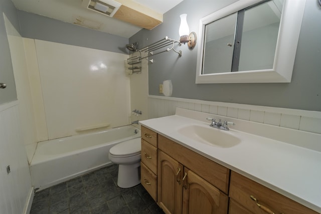 full bathroom featuring visible vents, wainscoting, toilet, tub / shower combination, and vanity