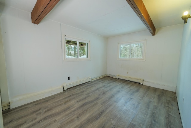 unfurnished room with plenty of natural light, beamed ceiling, baseboard heating, and a baseboard radiator