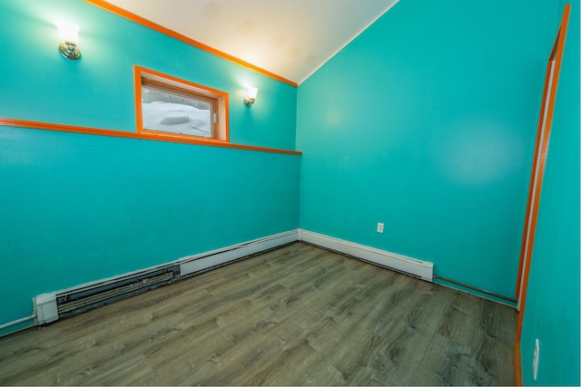 empty room with vaulted ceiling and wood finished floors