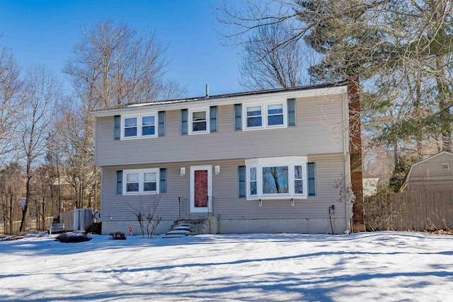 colonial-style house with a chimney