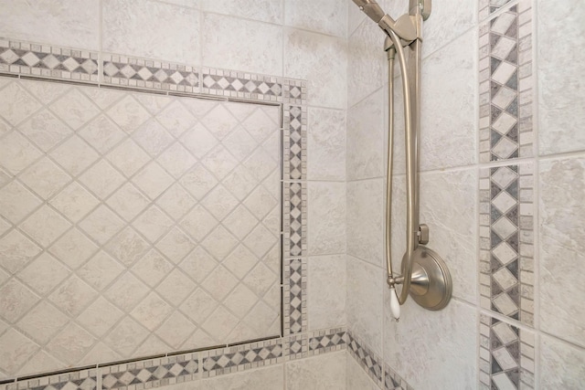 full bathroom with a tile shower