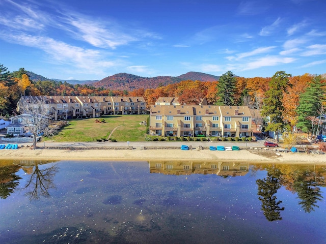 property view of water with a residential view and a mountain view