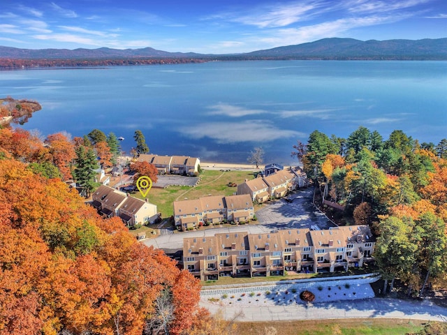 aerial view featuring a water and mountain view