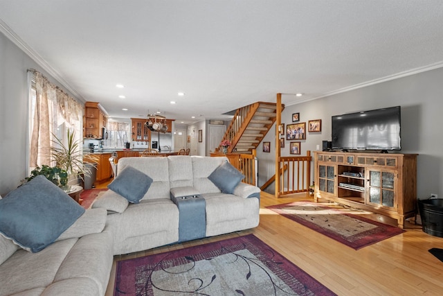 living room with stairs, recessed lighting, wood finished floors, and crown molding