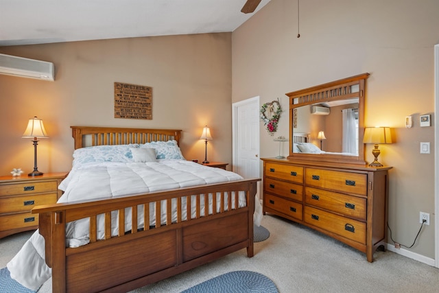 bedroom featuring ceiling fan, light colored carpet, baseboards, vaulted ceiling, and a wall mounted AC