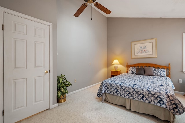 bedroom featuring lofted ceiling, carpet, baseboards, and ceiling fan