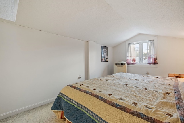 carpeted bedroom with radiator, vaulted ceiling, a textured ceiling, and baseboards