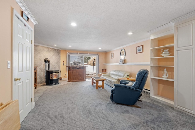 carpeted living room featuring a baseboard radiator, recessed lighting, ornamental molding, a wood stove, and a textured ceiling