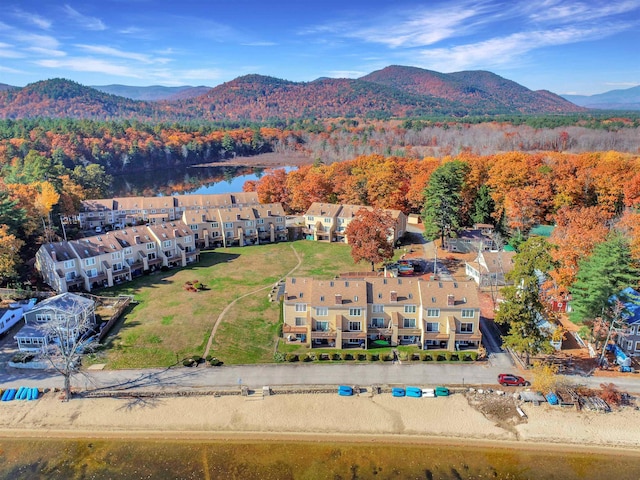 drone / aerial view featuring a water and mountain view