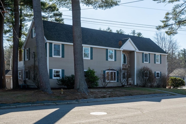 view of front facade with a shingled roof