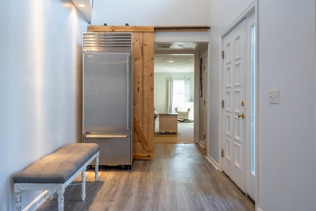 foyer featuring wood finished floors and recessed lighting