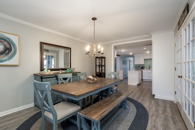 dining space featuring baseboards, ornamental molding, and dark wood-type flooring