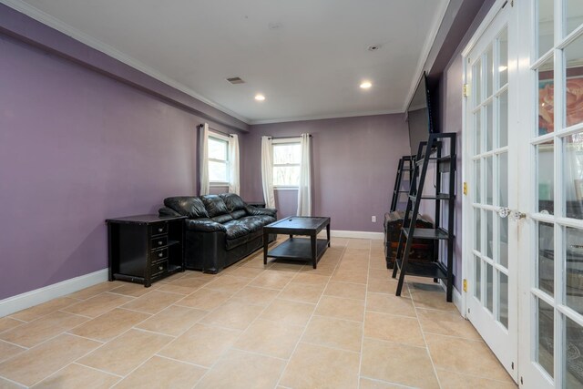 living room featuring light tile patterned floors, baseboards, visible vents, and ornamental molding