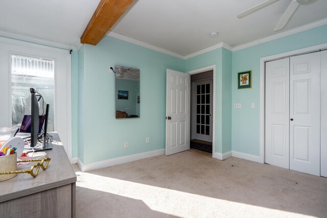 bedroom featuring baseboards, ceiling fan, ornamental molding, carpet floors, and beam ceiling