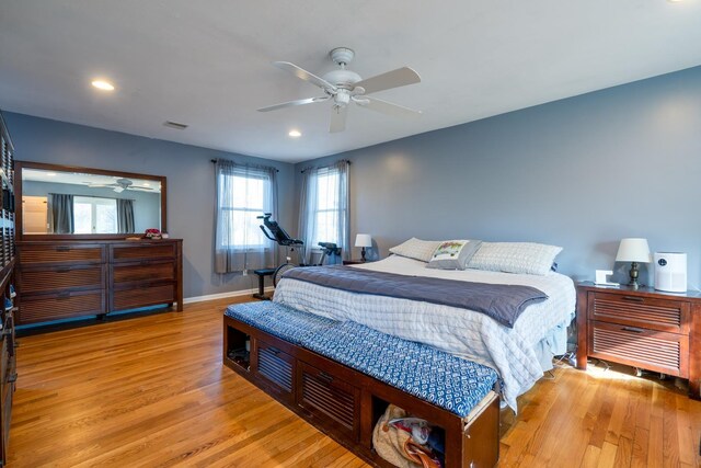 bedroom with light wood finished floors, recessed lighting, visible vents, ceiling fan, and baseboards