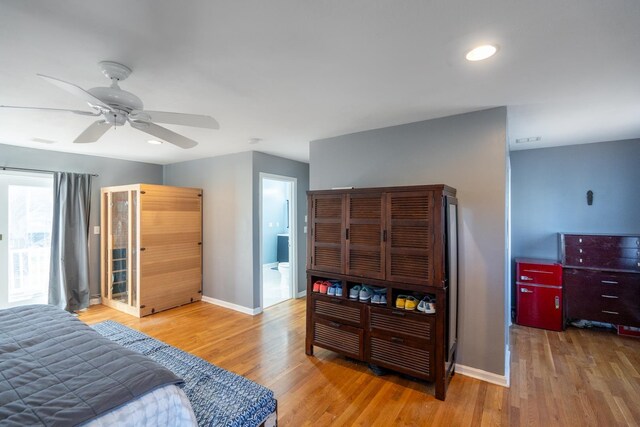 bedroom with light wood-style floors, recessed lighting, baseboards, and a ceiling fan