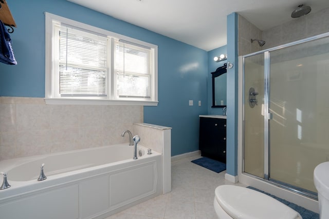 bathroom featuring a stall shower, vanity, and toilet